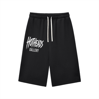 Front view of black Chaos in Art three-quarter sweatpants with white Hotheads Gallery artwork on one leg.