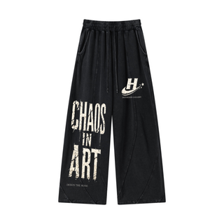 Front of snow-washed black Chaos in Art Curved-Panel Joggers with leg graphics